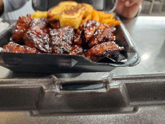 Rib tips with Mac and cheese and fries.