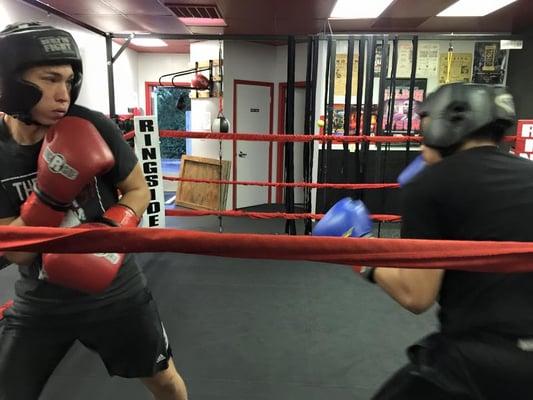 couple of the amateur boxers sparring during class