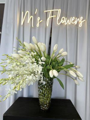 Elegant white tulips and orchids