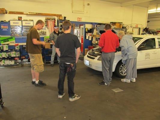 Taking a look under the hood at our second session of the car care clinic