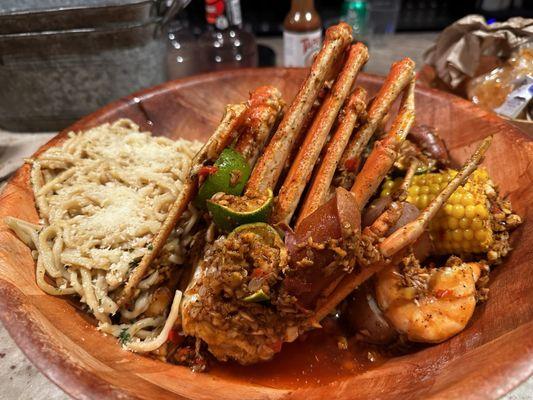 Pound shrimp, pound crab, and sausage with potatoes and corn. Oh, and garlic noodles.