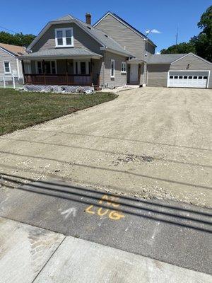 Sub base   Also left piece of old driveway until  the equipment no longer needs to be in driveway. Then removed