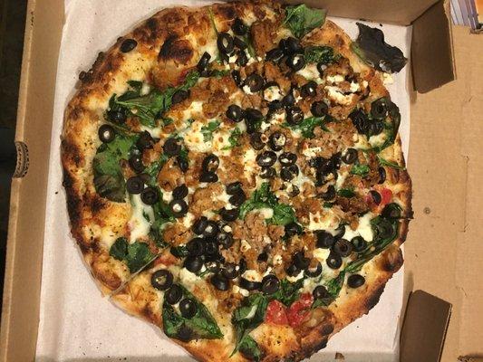 Pizza bianco with olives and sausage