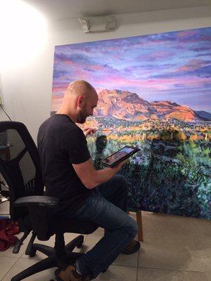 Brian working on a commissioned AZ painting "Red Mountain".