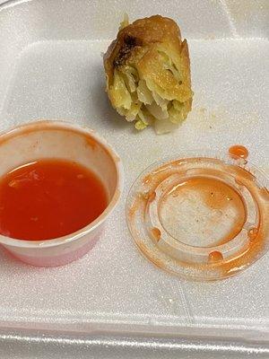 What's left of an egg roll with included sauce