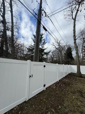 Fence of gate in backyard going over the power line. In my backyard