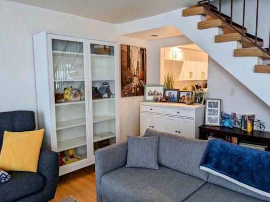 Removed the awkward protruding breakfast bar in front of the open window. Allowed for more furniture and space under the stairs