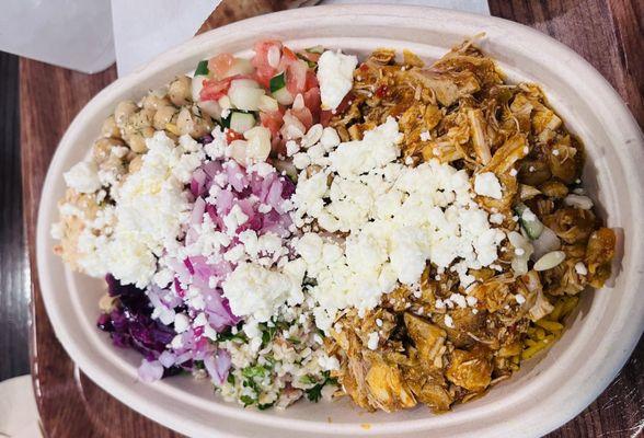 Spicy Chicken Rice Bowl- special hummus, Tabbouleh, Tomato & Cucumber Salad, feta, onion, cabbage, chickpeas. Unbelievable!