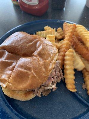 Beef brisket sandwich with crinkle fries!