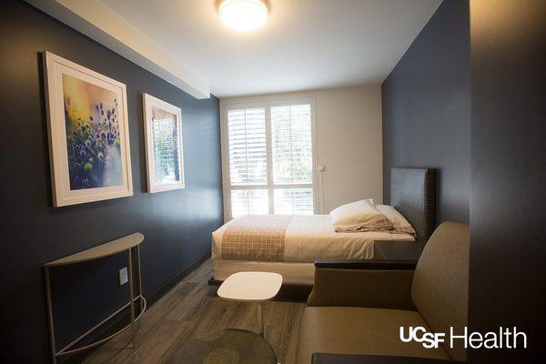 Sample room with one bed and one sleeper chair [photo courtesy UCSF].