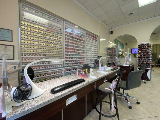 Manicure station - very clean and includes a clear partition between client and employee.