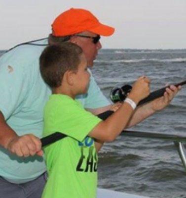 Johnny fighting his very first fish with a Golden Eagle mate right there helping!