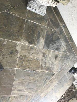 Water damage on slate tile. Outside porch. Can you give me an estimate?