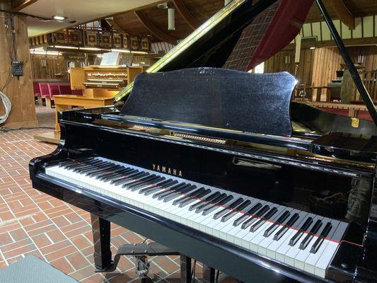 Newly moved organ console from the loft to the main floor 2022, and grand piano