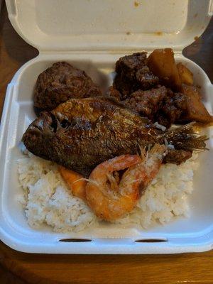 Lunch box - spare ribs, meatballs, fried fish, and fried shrimp. Slightly under seasoned and bland