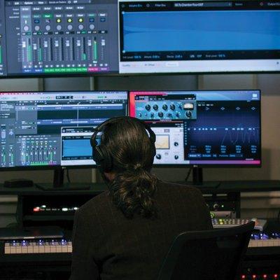 Teacher Joe Wagner edits a track in the recording studio at Community Music School.