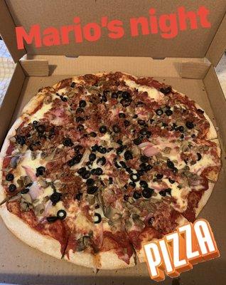 Mario's pizza with bacon, onion, black olives and mushrooms, delish as always. My Favorite pizza pie