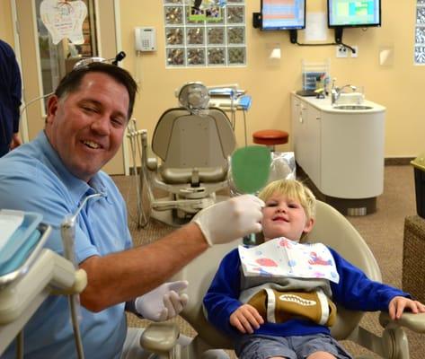 Dr. Nick keeping smiles on our first time dental patient.