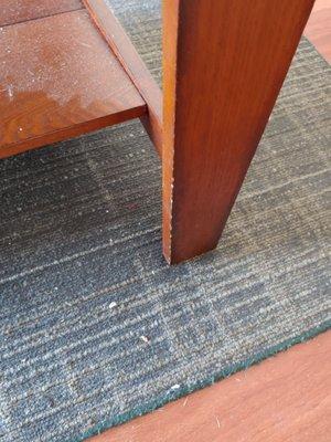 Look at the dust on the coffee table shelf and filthy carpet