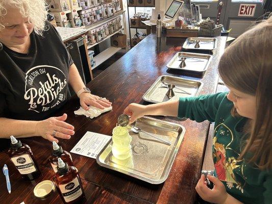 Pouring the scent into the wax