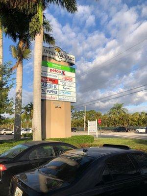 Parking lot view of the entrance to Lantana Square.