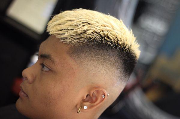 A Mid-skin fade along with a textured crop top