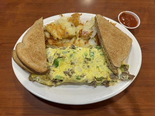 Steak omelette with peppers and onions.