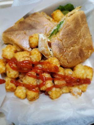 Chicken panini with pesto and tater tots