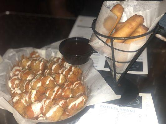 Buffalo tots and cheeesteak egg rolls