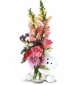 Send Teleflora's adorable little bear with enchanting flowers, and someone special will think you're just as sweet as can be.