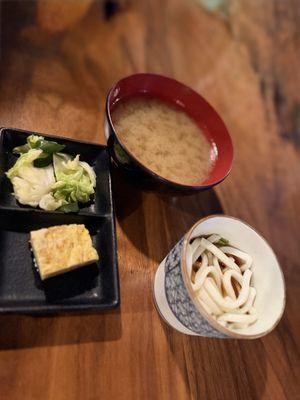 Soup, cold udon noodles, tamago and seasoned veggies (included in meal)