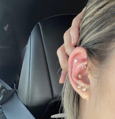 Conch and flat piercing by Tevita