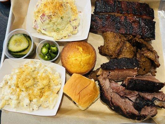 Combo 4 Plate ($26) with Tri Tip, brisket, and ribs (+$3), potato salad, Mac and cheese, + garlic cornbread ($1.50)