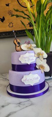 Buttercream icing, Fresh orchids, Fondant guitar was done by me, they weren't able to do it.