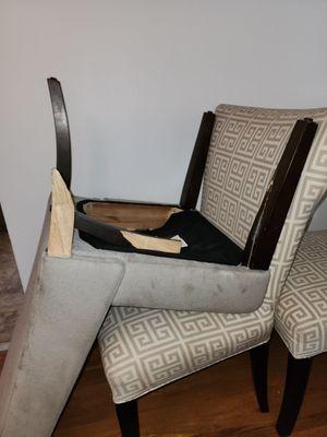 Side chair with 1 leg fully broken off and another splintered to the base of the chair