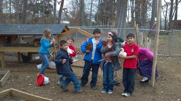 Happy kids with their chickens.