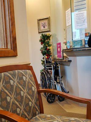 Christmas Tree and wheelchair available for the transportation of her patients.  12/21/2023