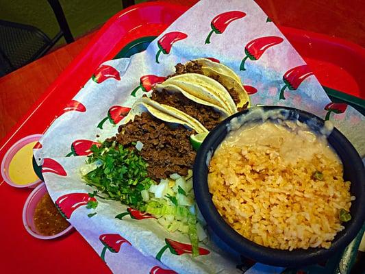 Beef fajita tacos with rice and beans