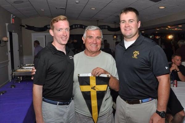 Distinguished club member receiving burgee from West Point Sailing Team - 2015 Spirit Rider Regatta.