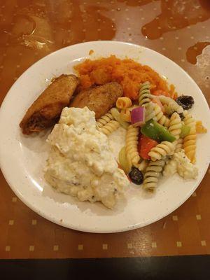 Lemon pepper chicken wings, potatoe salad, pasta salad, sweet potatoes.