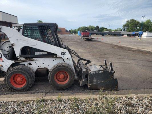 Foreman Gabe milling/grinding away the old asphalt to prep for the new asphalt