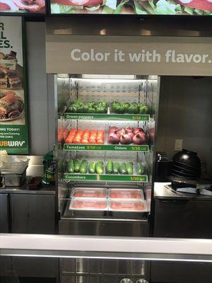 Vegetables on display behind the counter