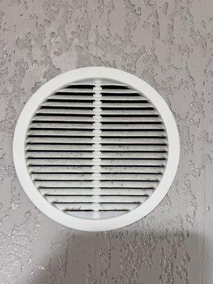 Bathroom vent that is not a vent. It's simply a hole in the wall.