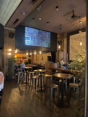 The view of the lounge area in the back of the bar with a DJ booth.