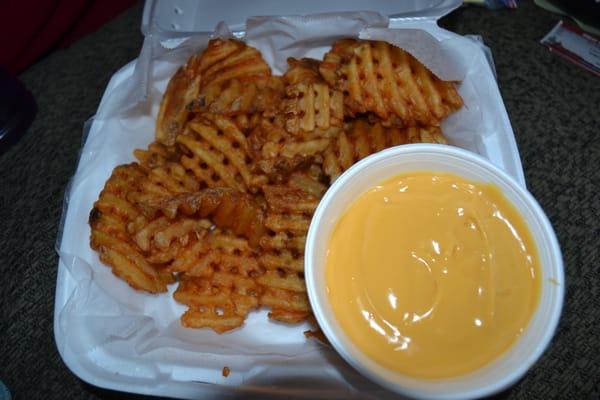 Waffle fries with nacho cheese sauce