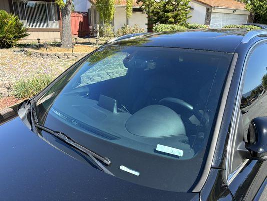 Air80 on the front windshield. No darkness since it's clear, but you can kind of see the coating that helps w/ UV and heat rejection.