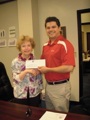 Garrett Spegar State Farm donated $500 to Trinity HS for the "Kick for Cash" event at the Football State Championships in 2011.