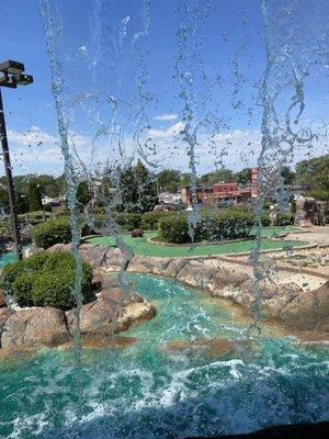 Behind the waterfall.