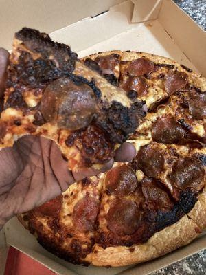 Burned Pizza Hut pizza