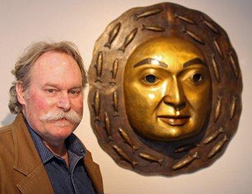 Northwest Coast artist, James Bender with bronze moon mask